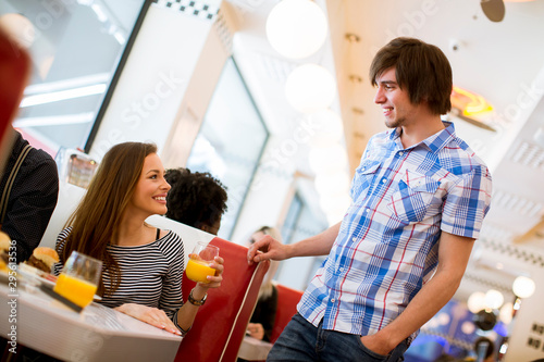 Young couple eating in the ...
