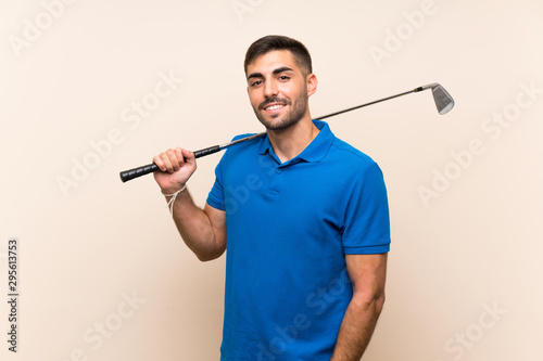 Young handsome golfer man over isolated background