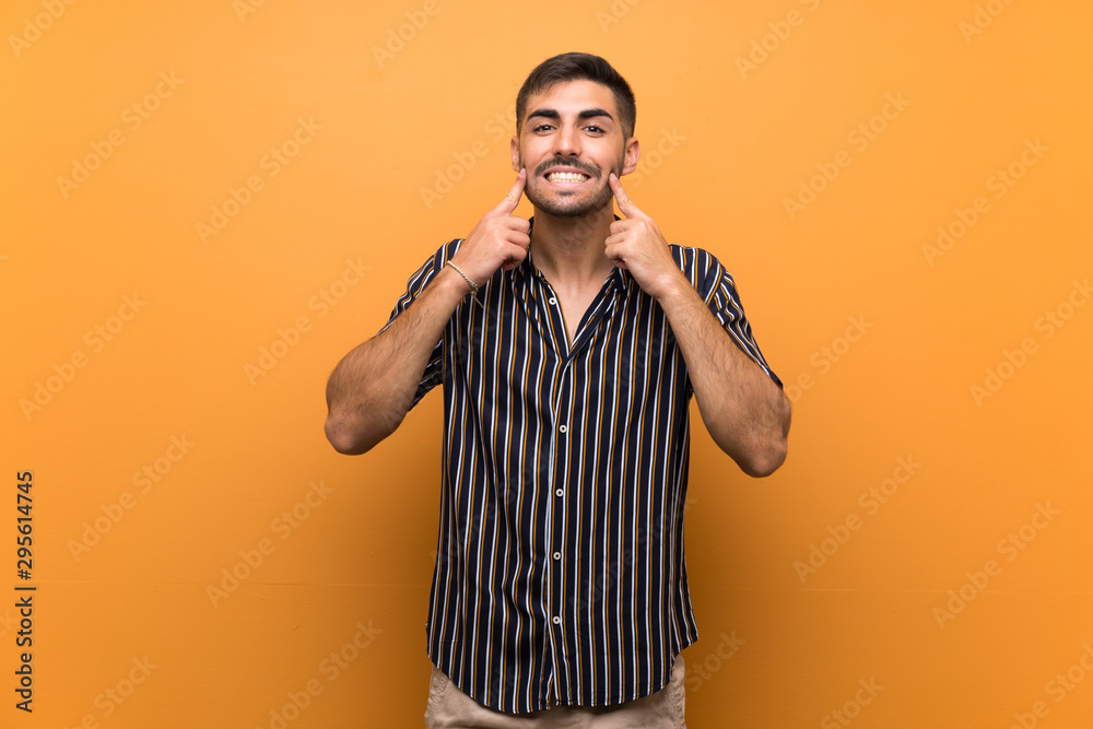 Handsome man with beard over isolated background smiling with a happy and pleasant expression Handsome man with beard over isolated background smiling with a happy and pleasant expression