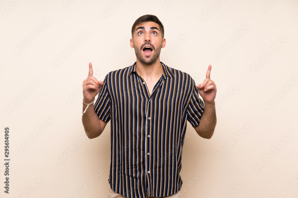 Handsome man with beard over isolated background pointing with the index finger a great idea Handsome man with beard over isolated background pointing with the index finger a great idea