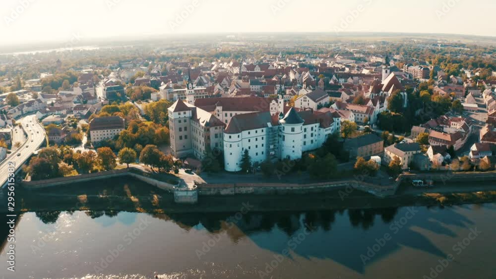 Top panoramic view over an old renaissance castle Hartenfels in the old town of Torgau near Leipzig, Saxony, Germany by the Elbe river on a sunny day