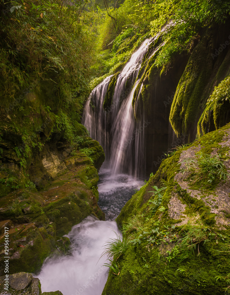 Waterfall in early morning with mountain creek