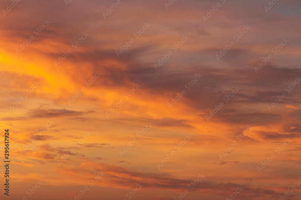 Colorful dramatic sky at sunset with pasted clouds