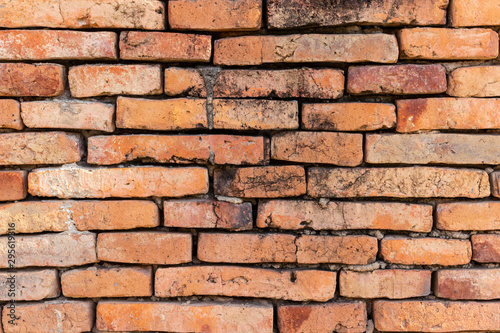 brick walls background and texture. The texture of the brick is orange. Background of empty brick basement wall.