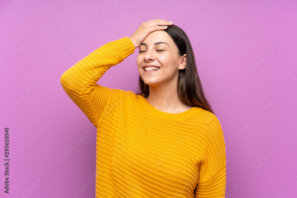 Young woman over isolated purple background laughing Young woman over isolated purple background laughing