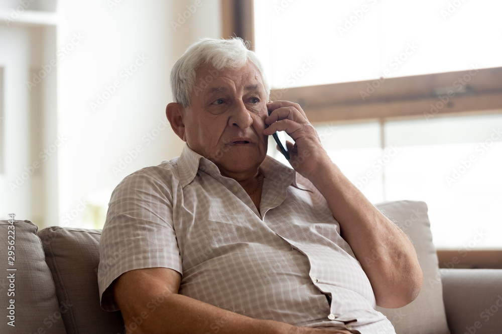Elderly man talk on phone having distant communication with doctor Elderly man talk on phone having distant communication with doctor