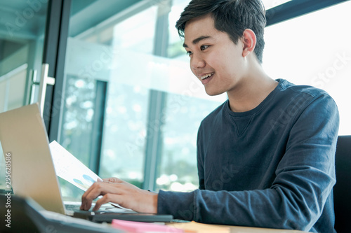 Free Download male freelancer working with computer document. startup man analyzing financial performance. student studying doing assignment - GFXLoad