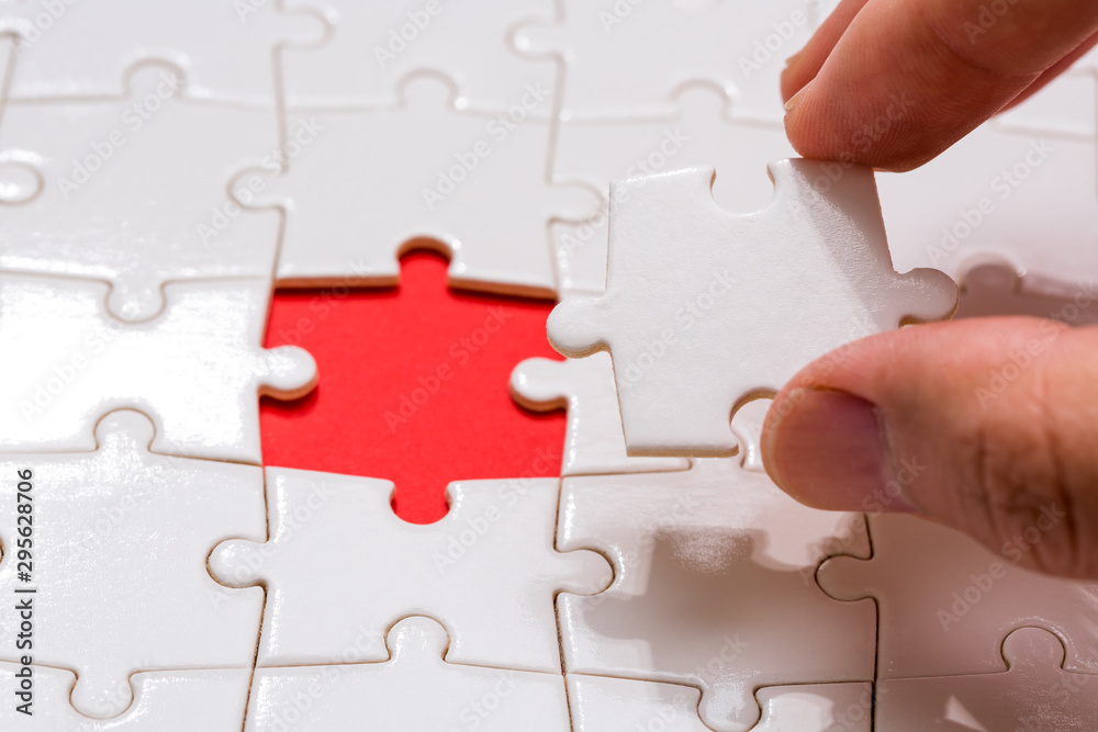 The last piece of jigsaw puzzle concept, solutions or completion The last piece of jigsaw puzzle concept, solutions or completion