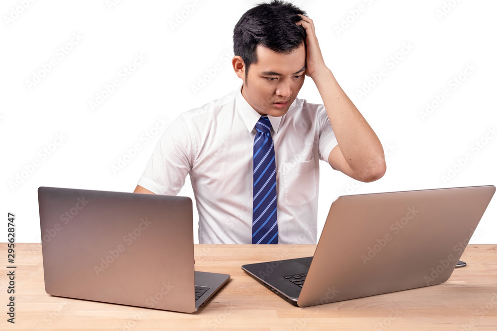 Stressed Asian business people with 2 laptops Stressed Asian business people with 2 laptops