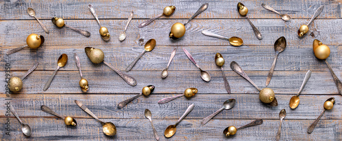 Merry Christmas! Vintage cutlery in santa claus hats on old wooden background.