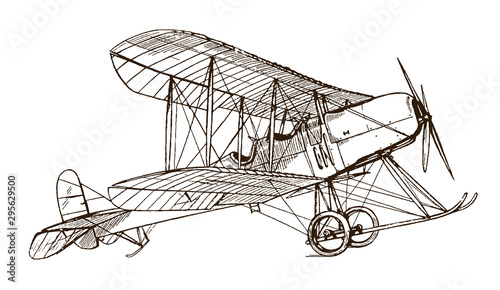 Historical British single-engine two-seat tractor biplane in side view, standing on the ground, ready for takeoff