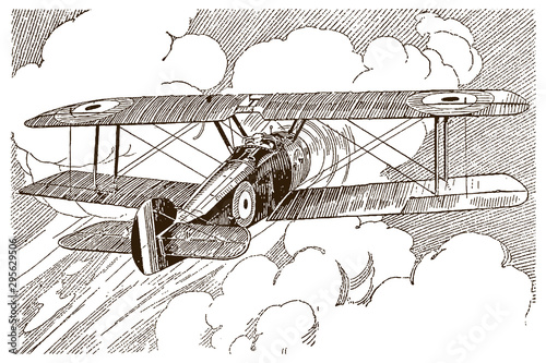 Antique British single-engine tractor one-seat biplane in back view, flying towards huge cumulus clouds