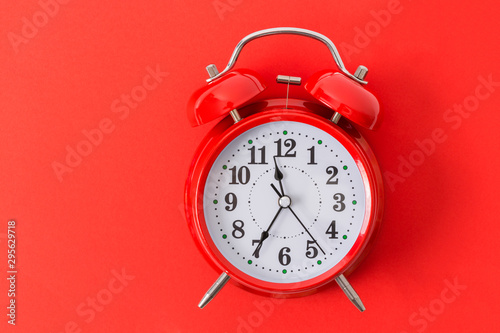 Red Alarm Clock On Red Background With Copy space