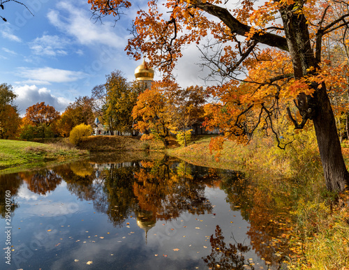 The colors of autumn. Beautiful view reflection on an old church