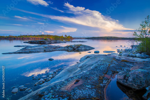 Karelia. Landscape Of Russia. Lake Ladoga. Northern nature. Nature Of Karelia. Rocky cliffs protrude from the water. Horizon.