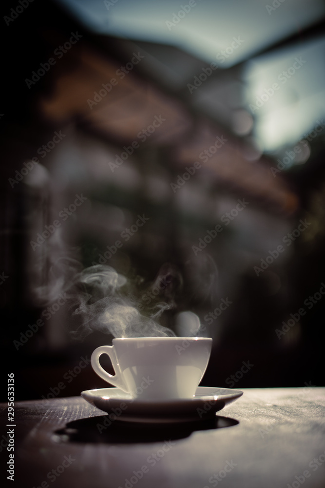 Steamy coffee cup in the sunlight Steamy coffee cup in the sunlight