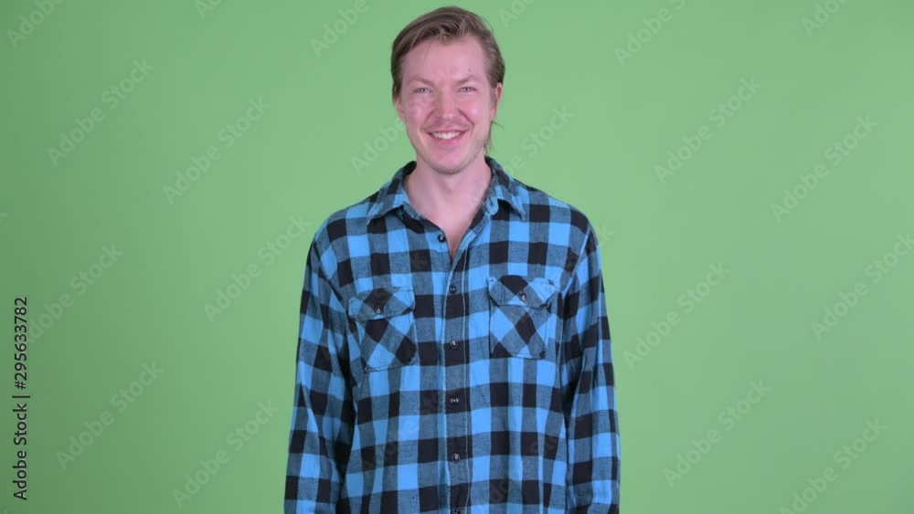 Happy young handsome hipster man smiling Happy young handsome hipster man smiling