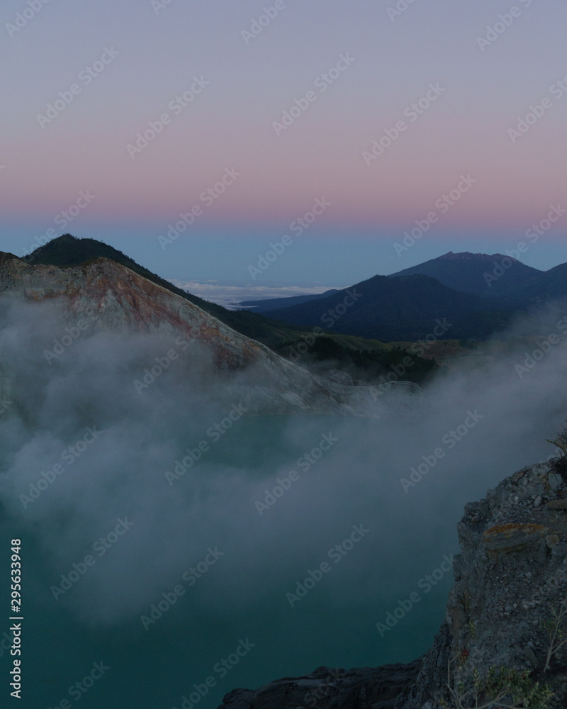 First light with fog. Sunrise on on the mountain  Ijen  Java ,Indonesia.