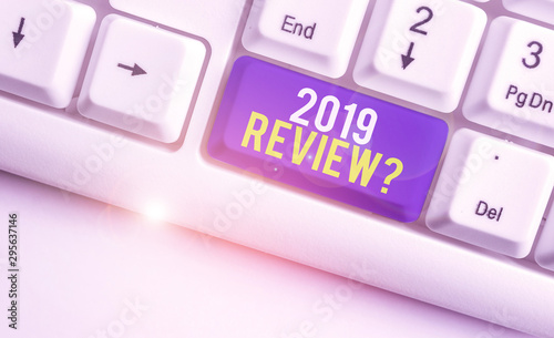 Word writing text 2019 Review Question. Business photo showcasing remembering past year events main actions or good shows White pc keyboard with empty note paper above white background key copy space photo