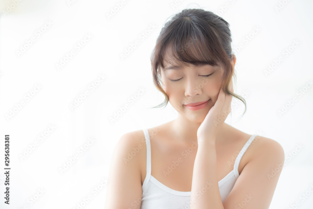 Portrait of beautiful young asian woman smile while wake up healthy and wellness with sunrise at morning in the bedroom, asia girl skin care with happy with fresh, lifestyle and relax concept. Portrait of beautiful young asian woman smile while wake up healthy and wellness with sunrise at morning in the bedroom, asia girl skin care with happy with fresh, lifestyle and relax concept.