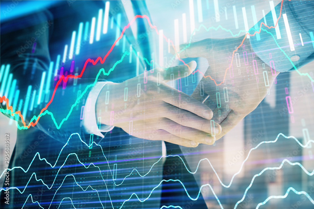 Double exposure of financial graph on cityscape background with two businessman handshake. Concept of stock market deal