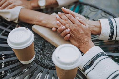 Caucasian woman hands lying on a table