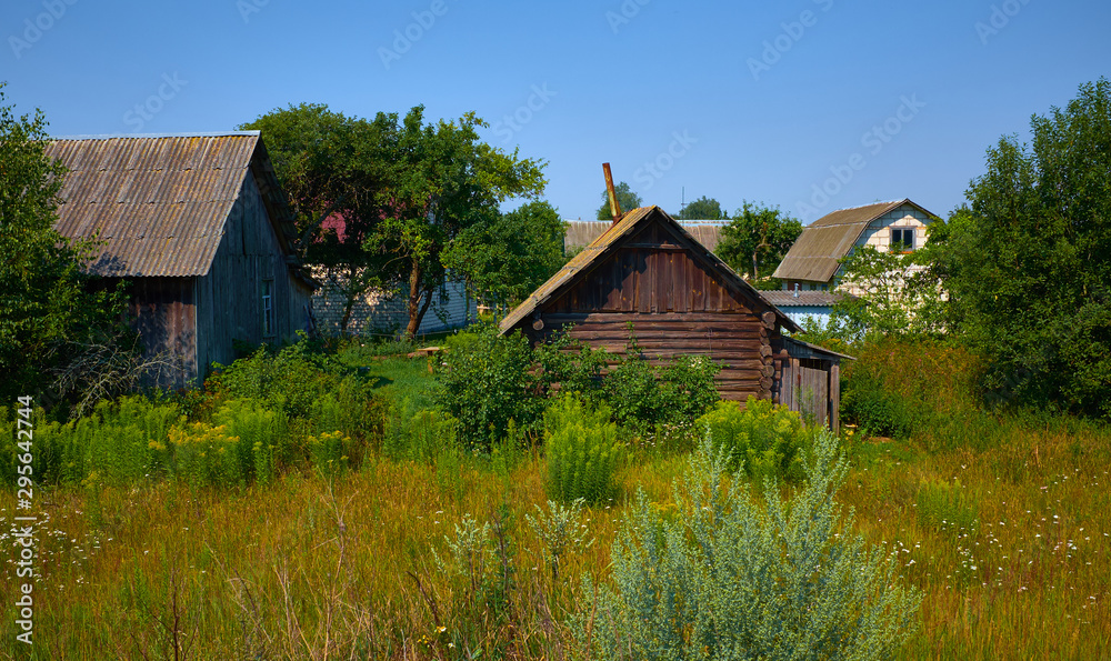 Belarus, Russian old wooden village houses at sunny day