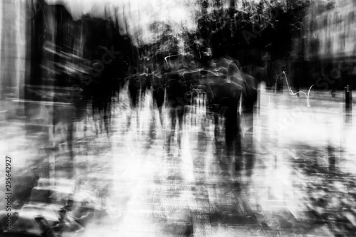 Long exposure of pedestrians walking along the high street - intentional camera shake to introduce an impressionistic effect and light trails - creative filter applied creating a ghostly aesthetic © Matthew