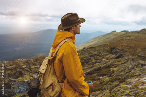 young lonely man looking for the inspiration in landscape, hiker is keen on climbing, close up side view photo, copy space
