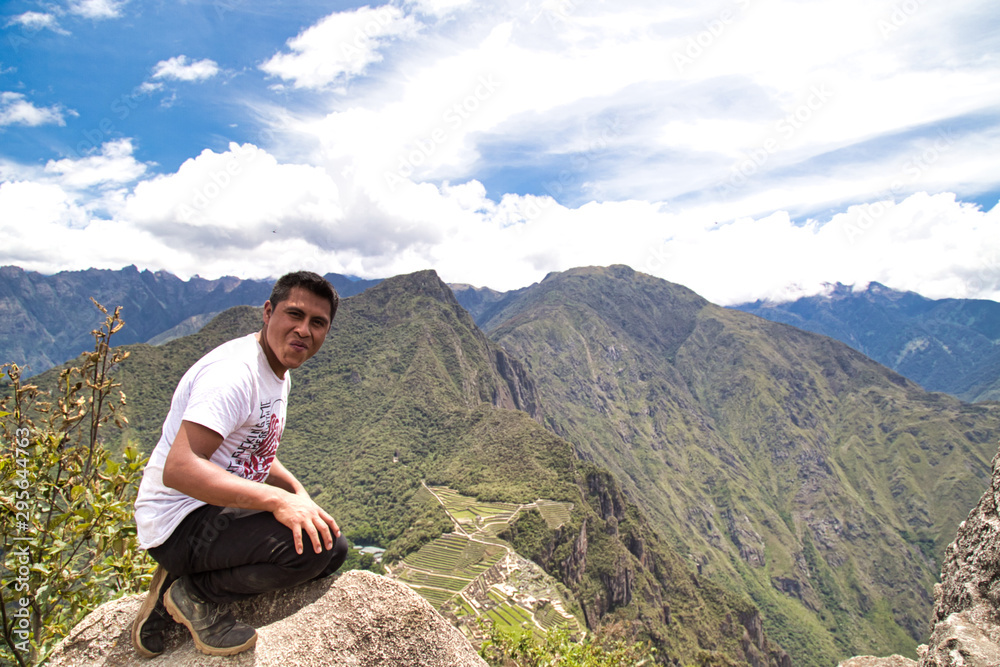 Traveller at the Lost city of the Incas, Machu Picchu,Peru on top of the mountain, with the view panoramic Traveller at the Lost city of the Incas, Machu Picchu,Peru on top of the mountain, with the view panoramic