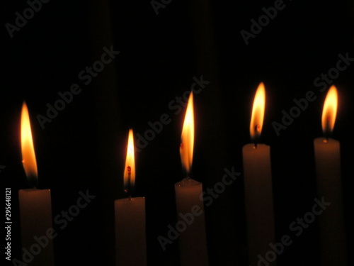 Beautiful photo of candles in a church lit for the feeling