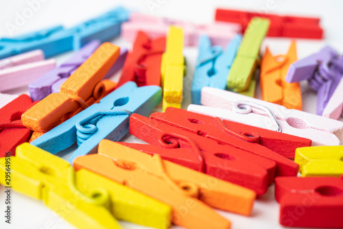 A pile of wooden colorful clothespins