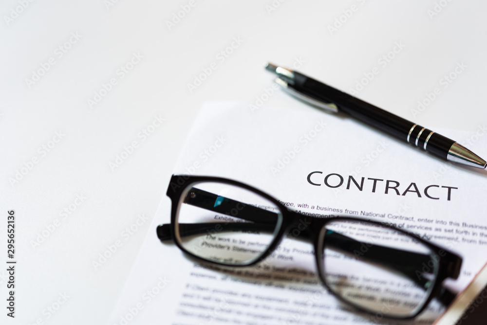 White table with business document contract form paper and empty space to sign authorized signature, copy space available for text White table with business document contract form paper and empty space to sign authorized signature, copy space available for text
