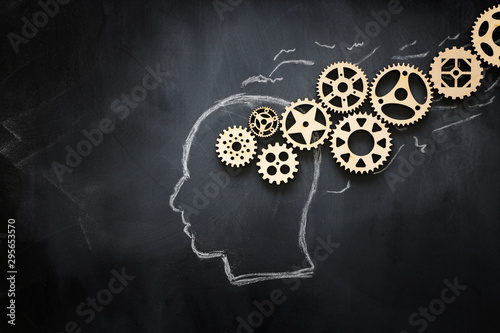 medical concept of Brain made from wooden puzzle into human head. idea of thinking, workflow, adhd and learning photo