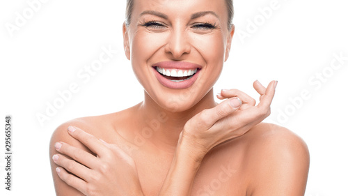 Happy woman with perfect skin isolated on white background.