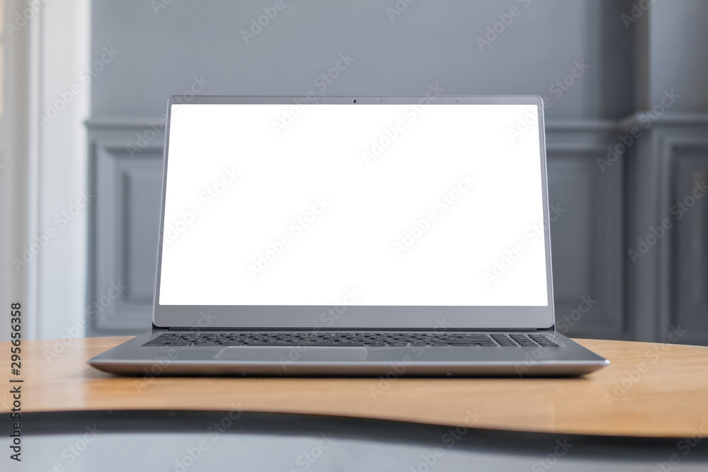 Mock up, copyspace, freelance workspace, template, entertainment and technology concept - grey laptop with white blank screen on wooden table in home interior - mockup image Mock up, copyspace, freelance workspace, template, entertainment and technology concept - grey laptop with white blank screen on wooden table in home interior - mockup image