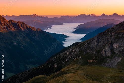 Beautiful Sunrise in Mountains. Fog and Clouds in Valley. Sunlight at Peaks © marcin jucha