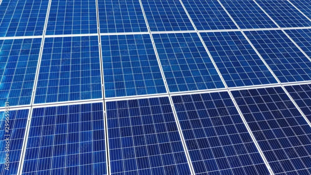 Flight over working energy batteries. Solar batteries work on a roof to accumulate the sunlight. Close-up. Flight over working energy batteries. Solar batteries work on a roof to accumulate the sunlight. Close-up.