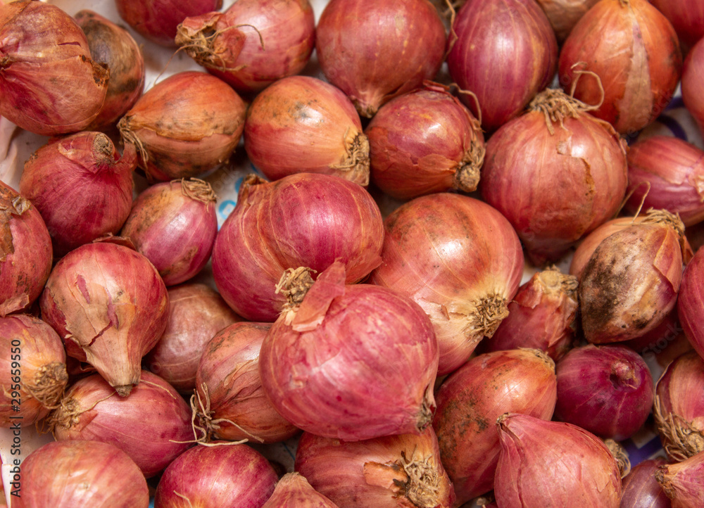 Close view of onions (shallots) in a basket Close view of onions (shallots) in a basket