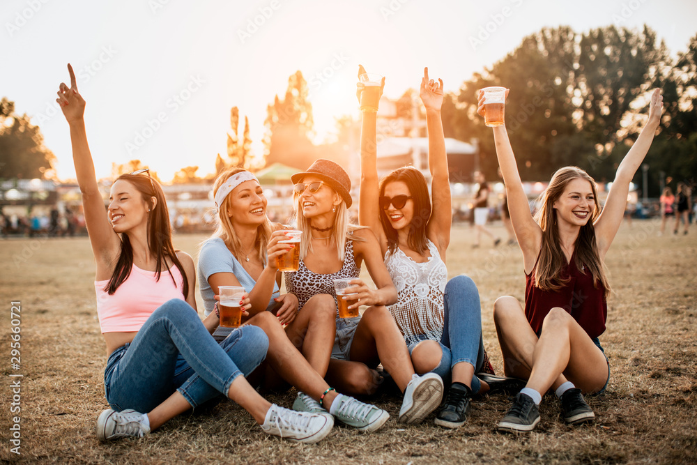 Friends drinking beer and having fun at music festival Friends drinking beer and having fun at music festival