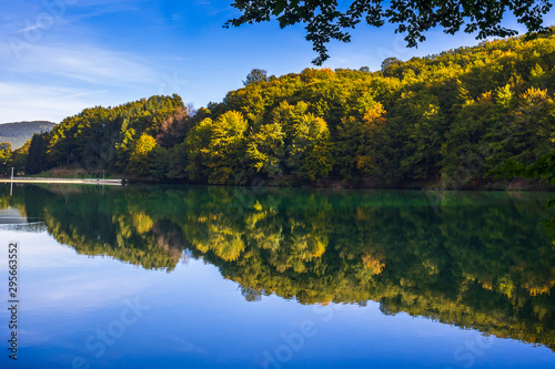 Beautiful turquoise lake surrounded by green forest and mountains. Balkana lake in Bosnia and Herzegovina.