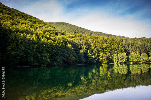 Beautiful turquoise lake surrounded by green forest and mountains. Balkana lake in Bosnia and Herzegovina.