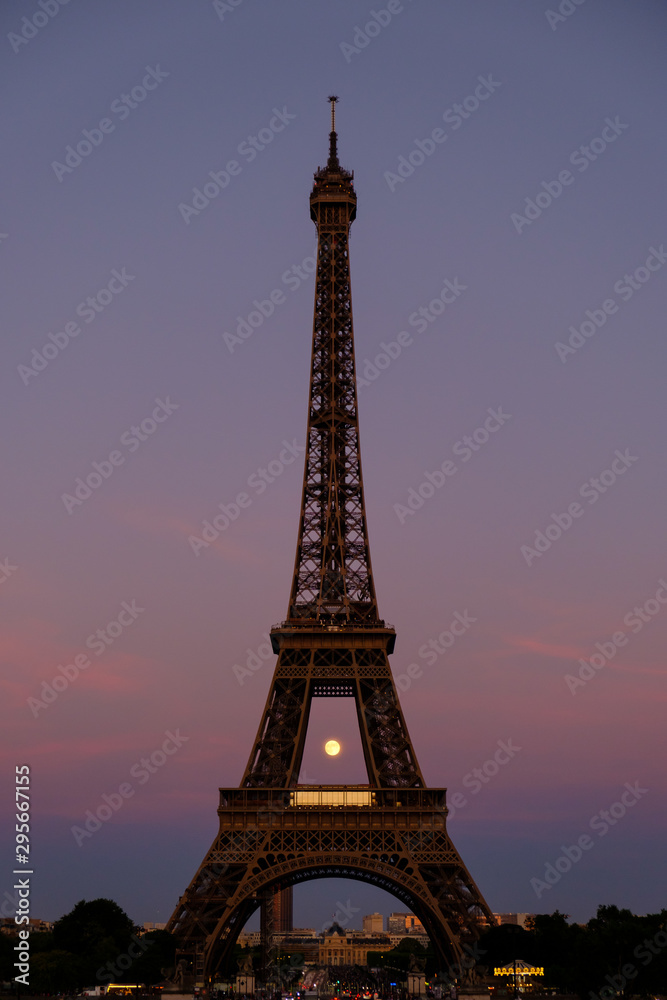 Eiffel Tower in sunset with the Moon