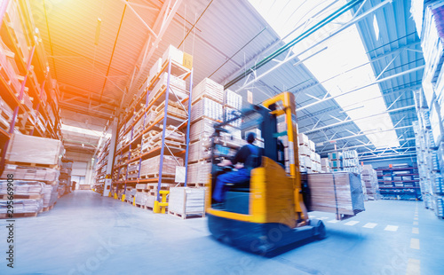 Forklift loader in storage warehouse ship yard. Distribution products. Delivery. Logistics. Transportation.