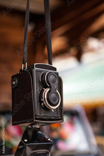 The old Soviet medium format film camera hanging on a belt at a flea market