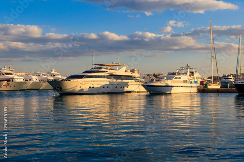 White yachts in the sea harbor of Hurghada, Egypt. Port with tourist boats on the Red Sea