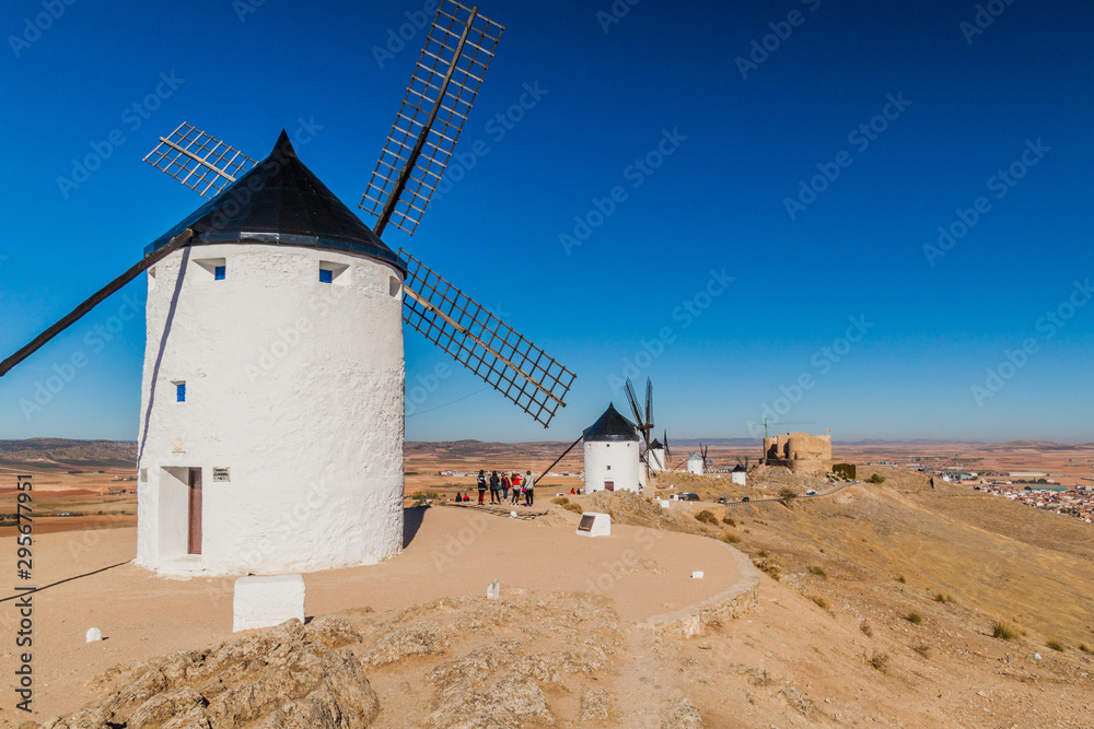 CONSUEGRA, SPAIN - OCTOBER 24, 2017: Windmills located in Consuegra village, Spain CONSUEGRA, SPAIN - OCTOBER 24, 2017: Windmills located in Consuegra village, Spain