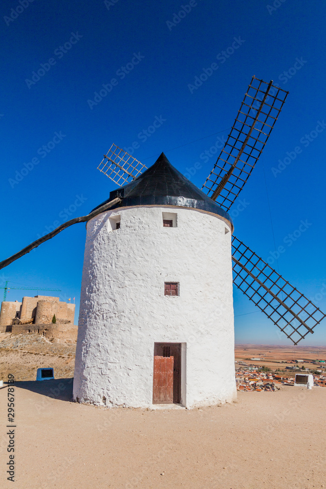 Windmill and a castle in Consuegra village, Spain