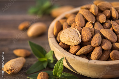 Carta da parati Fresh almonds in the wooden bowl