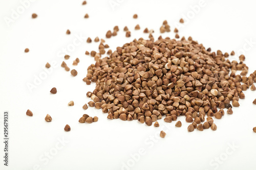 handful of buckwheat on a white table